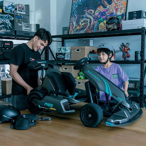 Teens assembling Gokart Pro 2 Electric Go Kart For Teens 14 Plus, Drift And Race Ready with 26.7 MPH Top Speed indoors