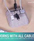 Magnetic Cord Holder Cable Organizer With Magnet Clips For Charger Management On Desktop And Nightstand Keeps USB C And Lightning Cables Tucked And Ready To Roll No Slips Premium Desk Accessory In Light Toasted Beige on desk.