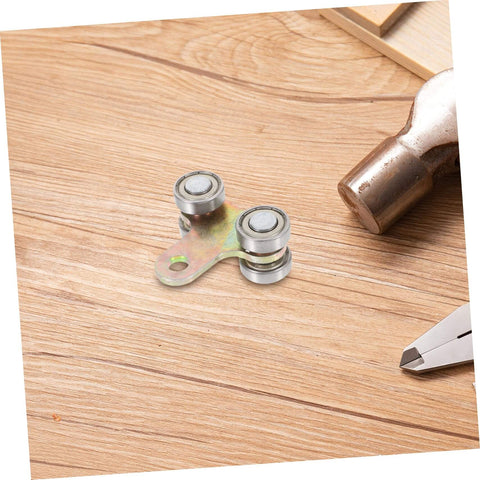 Premium stainless steel trolley rollers for sliding door track systems on a wooden surface, four-wheel assembly highlighted.