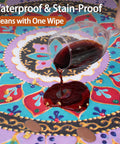 Fitted Round Tablecloth Waterproof Vinyl Circle Cover Fits 36 to 44 Inch Tables Indoor Outdoor Dining Home Patio Party Gear and Gifts, Perfect for Summer and Fall Picnics, Camping, Kitchen with red wine stain being cleaned off tablecloth.