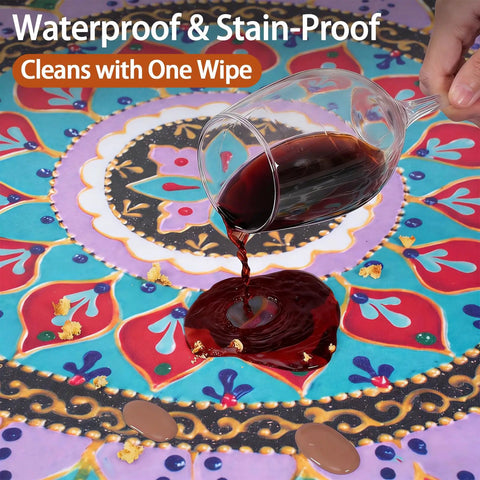 Fitted Round Tablecloth Waterproof Vinyl Circle Cover Fits 36 to 44 Inch Tables Indoor Outdoor Dining Home Patio Party Gear and Gifts, Perfect for Summer and Fall Picnics, Camping, Kitchen with red wine stain being cleaned off tablecloth.
