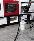 Heavy Duty Quick Click Dust Separator Featuring Slick Twelve Gallon Locking Collection Bin And Efficient Air Relief Design in a workshop.