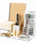 Acrylic Desk Organizer With Six Compartments, Pen And Pencil Holder, Clear Desktop Caddy for office supplies filled with stationery items.