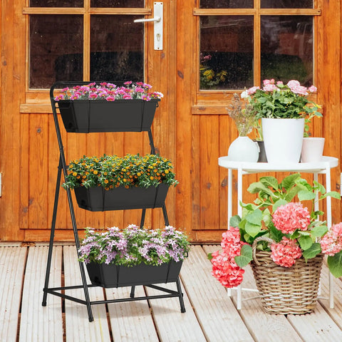 Front view of black Space Saving 3 Tier Raised Garden Bed Vertical Planter With Drainage Holes And Removable Tray on patio
