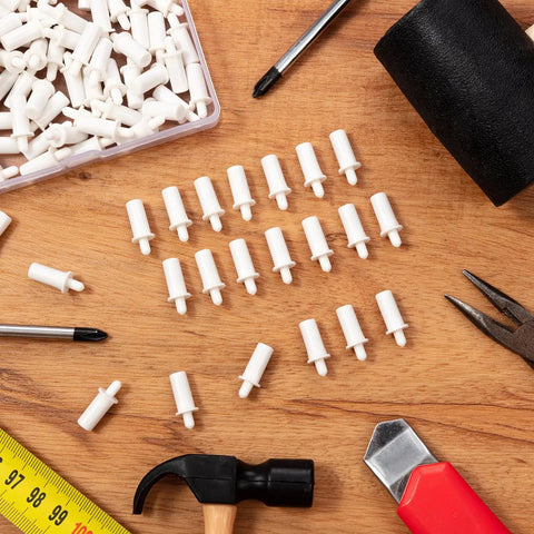 120 Pcs Spring Loaded Plantation Shutter Repair Pins With Heavy Duty Design For A Hella Easy Diy Window Blind Fix That Makes Home Upgrades A Total Breeze Today laid out on a wooden surface with tools.