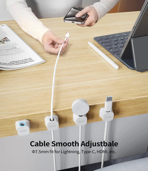 Magnetic Cable Clips Cord Organizer Set For Desk And Office displayed on a desk, securing various cables like USB, Lightning, HDMI.