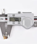 Front view of a small metal planetary gearhead motor with a digital caliper showing 5.56 mm