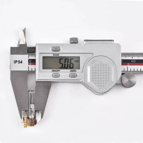 Front view of a small metal planetary gearhead motor with a digital caliper showing 5.56 mm