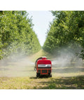 Heavy Duty Crawler Sprayer With Tracked Base For Rough Terrain. Remote controlled sprayer moving through an orchard.