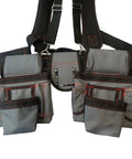 Professional Carpenter Tool Belt With Adjustable Suspenders Multi Pocket Hammer Loop And Built Tough Weight Distribution For The Daily Jobsite Grind. Gray canvas tool belt with multiple pockets and heavy-duty suspenders.