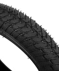 Close-up of tread pattern on Beefed Up 12.5x2.25 Tire And Inner Tube Set For Scooters And Electric Bikes, heavy duty construction.