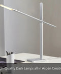 Sleek silver desk lamp on table with pen holder and notebook, modern design, adjustable arm, bright LED light