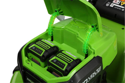 40V Cordless 21-Inch Brushless Push Mower With Dual 4.0Ah And 2.0Ah USB Batteries, Charger Included, Automatic Battery Switch-Over For Longer Run Time, Easy One-Lever 7-Position Height Adjustment. Close-up of dual Greenworks batteries in mower compartment.