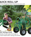 Man using Heavy Duty Garden Hose Reel Cart Holds Up To 300 Feet Of Hose, Tough Four Wheel System With Built In Storage