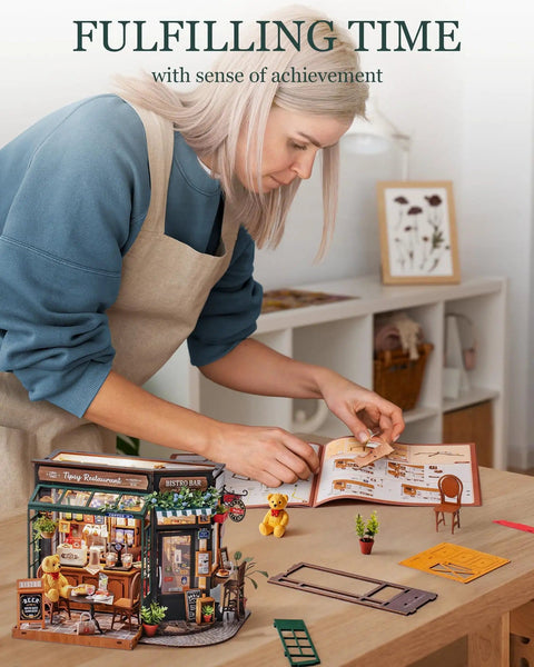 Woman assembling One Eighteen Scale Coffee Bar Dollhouse Kit With Led Lights Diorama Miniature House Building Kit For Adults.