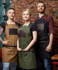 Chefs wearing Black Canvas And Leather Apron For Chefs Bartenders Baristas Barbers And Grill Masters Handmade In USA