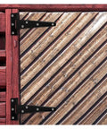 Heavy Duty T Hinges Six Pack Rust Proof Iron Build on a wooden door, showcasing solid black iron for sturdy barn use.