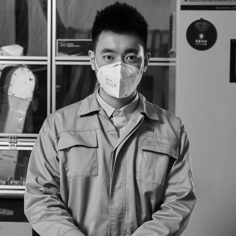 Person wearing N95 Particulate Respirator 9502 Plus Pack Of 50 NIOSH Approved Disposable Face Mask in industrial setting