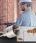 Worker using 9 Piece Concrete Hole Saw Kit Heavy Duty With Tungsten Steel Core Bits For SDS drills on brick wall