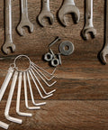 Get This 10 Piece Hex Wrench Set With Key Ring For Biking And Home Fixes That Totally Slings Tightening Bolts Smoothly For Any Auto Or DIY Job Needing Versatile Tooling Magic. 10 silver hex keys on ring on wood