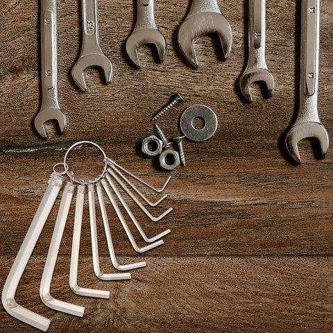 Get This 10 Piece Hex Wrench Set With Key Ring For Biking And Home Fixes That Totally Slings Tightening Bolts Smoothly For Any Auto Or DIY Job Needing Versatile Tooling Magic. 10 silver hex keys on ring on wood
