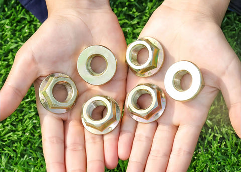 Heavy Duty Hex Flanged Spindle Blade Nuts Engineered For Slick Hella Smooth Operation On Cub Cadet Mtd Toro And Troy Bilt Zero Turn Mowers Providing Killer 5/8 Inch 18 Thread Fitment Two Pack displayed in hands.