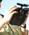 Person holding RadioMaster transmitter with Ranger Micro 2.4GHz ELRS Module for Transmitters, Unlock Long Range and Low Latency