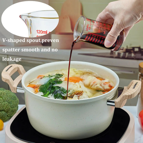 Glass Shot Measuring Cup 4oz for Cocktails and Espresso, red scale, pouring into pot, multi-scale markings in ounces milliliters cups