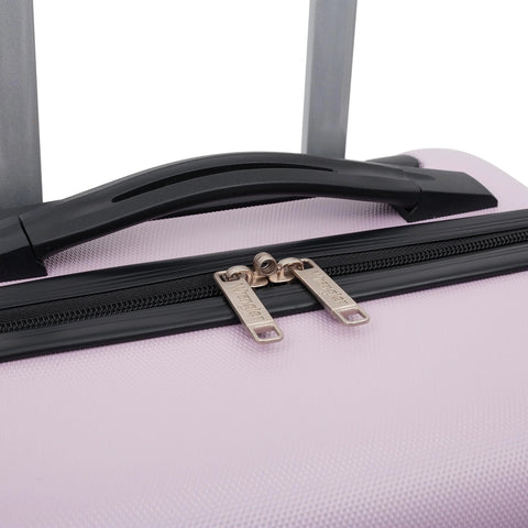 Luggage close-up of lilac 22in Wrangler hardside spinner carry-on with black top handle and dual metal zipper pulls