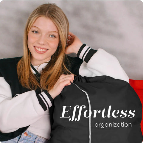 Smiling person holding Heavy Duty Nylon Laundry Bag With Locking Drawstring, Large 30x40 Inch Capacity, black color, text "Effortless organization".