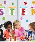 Children enjoying STEM activities with Stem Science Bulletin Board Set With Gear Shaped Cutouts, 40 Pcs Classroom Decorations in background
