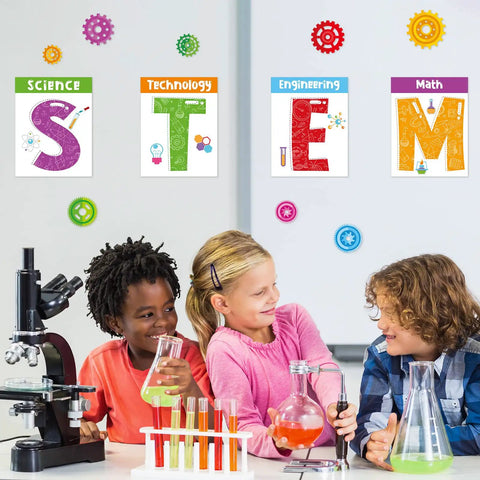Children enjoying STEM activities with Stem Science Bulletin Board Set With Gear Shaped Cutouts, 40 Pcs Classroom Decorations in background