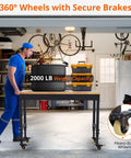 Tough As Nails Mobile Workbench 60 Inch Adjustable Shop Table with heavy-duty wheels and 2000 lb capacity in garage