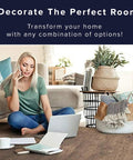 Woman on floor with laptop, coffee cup, and plant basket, showcasing Wood Grain Interlocking Foam Floor Tiles 24x24 Inch Three Eighths Inch Thick Anti Fatigue Mats For Home Office Studio Gym Homey Vibe Decor Easy Locking Foam Flooring Solution.