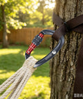 Beefy 25kN Locking Climbing Carabiner UIAA Certified Heavy Duty Large Size attached to tree with rope and knurl nut locking mechanism