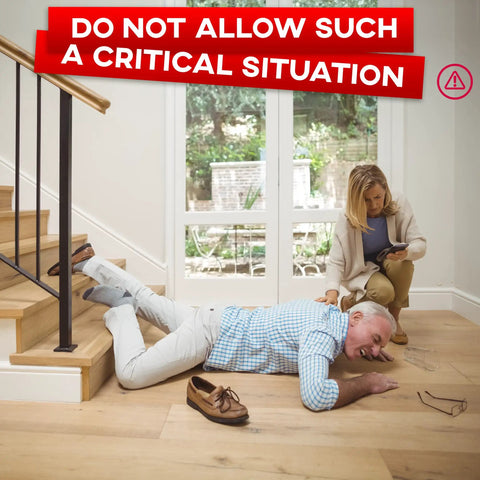 A man fallen on indoor wooden stairs, highlighting the need for Heavy Duty Anti Slip Tape For Stairs Indoor Outdoor Waterproof 4 Inch By 35 Ft Non Skid Adhesive Roll With Boss Level Grip And Traction For Steps Ramps And Treads Black while a woman assists.