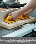 Hands using a Heavy Duty Push Block And Push Stick Set For Table Saws Router Tables Band Saws to safely guide lumber.