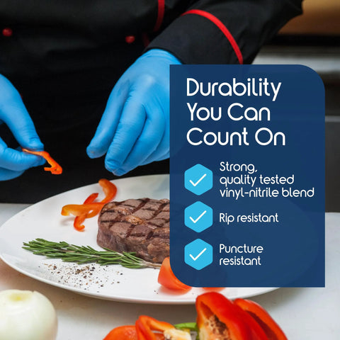 Nitrile-vinyl blend disposable exam gloves, blue, used for plating steak with peppers on a white plate