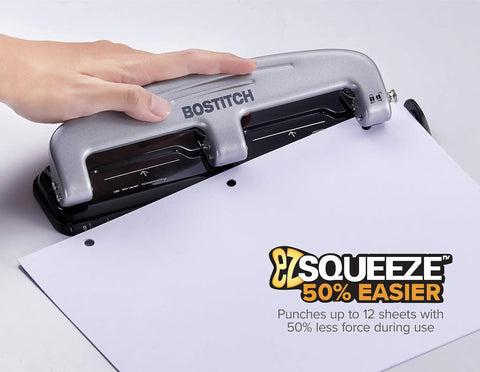 Person using EZ Squeeze Three Hole Punch For 12 Sheets No Jam 50 Percent Less Force Heavy Duty Metal Construction