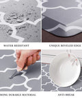 Waterproof grey anti fatigue kitchen mat with beveled edge showing water resistance, unique design, and durability against breakage.