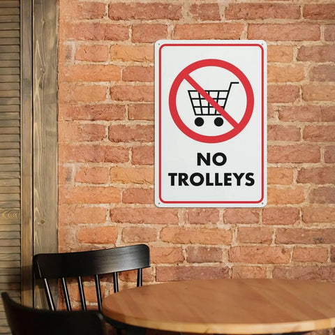 No Trolley Symbol 8 By 12 Warehouse Equipment Restriction Sign for Indoor Outdoor Use on brick wall with chair and table