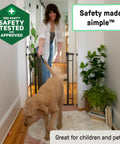 Woman using Extra Tall Baby and Pet Gate for Stairs and Doorways No Drill Pressure Mounted Fits Openings 28.5 to 48 Inches 36 Inch Height