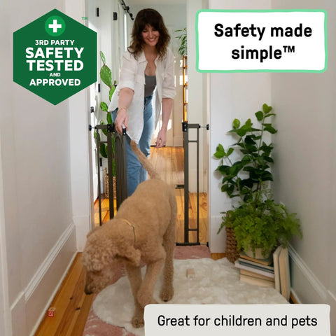 Woman using Extra Tall Baby and Pet Gate for Stairs and Doorways No Drill Pressure Mounted Fits Openings 28.5 to 48 Inches 36 Inch Height