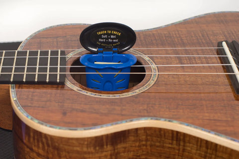 Humilele Ukulele Humidifier With Anti Drip Sponge Secures Between Strings And Fits All Sound Holes Keeps Your Ukulele Humidity Between Forty And Fifty Five Percent No Mess Water Reservoir That Holds Ten Times Its Weight in a ukulele sound hole