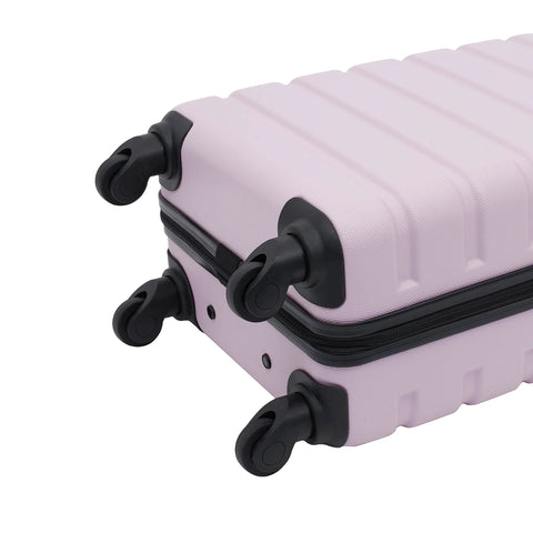 Bottom view of lilac 22-inch hardside spinner luggage with four black wheels