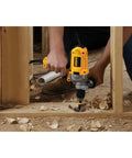 Corded Drill Powerhouse With 1/2-Inch Chuck, 10 Amp Motor, being used for heavy-duty woodworking in construction site.