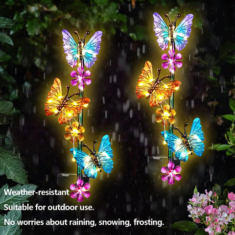 Outdoor Solar Butterfly Stake Lights Waterproof Garden Pathway Decor With Lit Up Soft Yellow Glow 2 Pack Garden Yard Lawn Patio Lights Easy Install Cozy Nighttime Ambiance For Yard showcasing colorful butterfly designs at night.