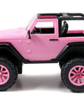 Side view of pink Jeep Wrangler 1:16 RC Car For Kids With 2.4GHz Remote, Full Function Ride With Turbo Boost, featuring doll seat.