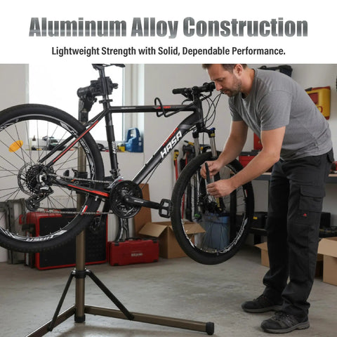 Man using Lightweight Aluminum Bike Repair Stand Portable Work Stand For Mountain MTB And Road Bikes Height Adjustable From 39 To 59 Inches Holds Up To 55 Lbs For DIY Home Garage Use in garage