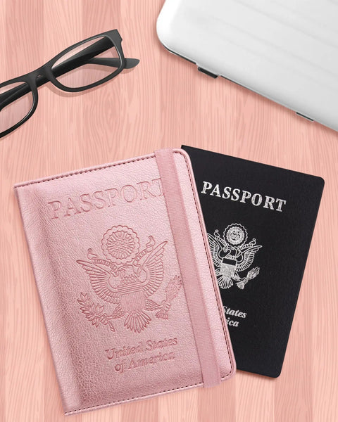 RFID Passport Holder For Travel Wallet With Pen Loop Elastic Closure And PU Leather Card Holder Passport Book Cover For Women And Men Rose Gold Accents next to black passport
